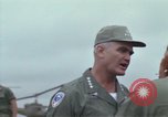 Image of Gen William C Westmoreland in conversation and departure in helicopter A Shau Valley Vietnam, 1968, second 15 stock footage video 65675026863