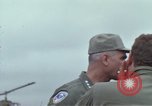 Image of Gen William C Westmoreland in conversation and departure in helicopter A Shau Valley Vietnam, 1968, second 16 stock footage video 65675026863
