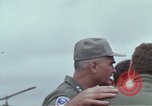 Image of Gen William C Westmoreland in conversation and departure in helicopter A Shau Valley Vietnam, 1968, second 17 stock footage video 65675026863