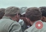 Image of Gen William C Westmoreland in conversation and departure in helicopter A Shau Valley Vietnam, 1968, second 21 stock footage video 65675026863