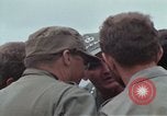 Image of Gen William C Westmoreland in conversation and departure in helicopter A Shau Valley Vietnam, 1968, second 22 stock footage video 65675026863