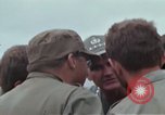 Image of Gen William C Westmoreland in conversation and departure in helicopter A Shau Valley Vietnam, 1968, second 23 stock footage video 65675026863