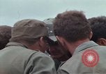 Image of Gen William C Westmoreland in conversation and departure in helicopter A Shau Valley Vietnam, 1968, second 26 stock footage video 65675026863