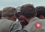 Image of Gen William C Westmoreland in conversation and departure in helicopter A Shau Valley Vietnam, 1968, second 29 stock footage video 65675026863