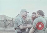 Image of Gen William C Westmoreland in conversation and departure in helicopter A Shau Valley Vietnam, 1968, second 30 stock footage video 65675026863