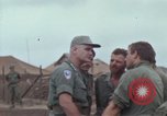 Image of Gen William C Westmoreland in conversation and departure in helicopter A Shau Valley Vietnam, 1968, second 31 stock footage video 65675026863