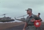 Image of Gen William C Westmoreland in conversation and departure in helicopter A Shau Valley Vietnam, 1968, second 38 stock footage video 65675026863