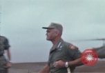 Image of Gen William C Westmoreland in conversation and departure in helicopter A Shau Valley Vietnam, 1968, second 39 stock footage video 65675026863