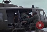 Image of Gen William C Westmoreland in conversation and departure in helicopter A Shau Valley Vietnam, 1968, second 47 stock footage video 65675026863