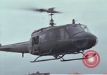 Image of Gen William C Westmoreland in conversation and departure in helicopter A Shau Valley Vietnam, 1968, second 54 stock footage video 65675026863