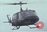 Image of Gen William C Westmoreland in conversation and departure in helicopter A Shau Valley Vietnam, 1968, second 56 stock footage video 65675026863