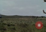 Image of Soldiers walking through the fields during Operation Delaware A Shau Valley Vietnam, 1968, second 15 stock footage video 65675026864