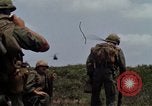 Image of Soldiers walking through the fields during Operation Delaware A Shau Valley Vietnam, 1968, second 20 stock footage video 65675026864