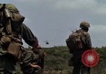 Image of Soldiers walking through the fields during Operation Delaware A Shau Valley Vietnam, 1968, second 21 stock footage video 65675026864