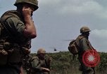 Image of Soldiers walking through the fields during Operation Delaware A Shau Valley Vietnam, 1968, second 22 stock footage video 65675026864