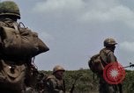 Image of Soldiers walking through the fields during Operation Delaware A Shau Valley Vietnam, 1968, second 24 stock footage video 65675026864