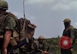 Image of Soldiers walking through the fields during Operation Delaware A Shau Valley Vietnam, 1968, second 28 stock footage video 65675026864