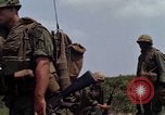 Image of Soldiers walking through the fields during Operation Delaware A Shau Valley Vietnam, 1968, second 30 stock footage video 65675026864