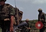 Image of Soldiers walking through the fields during Operation Delaware A Shau Valley Vietnam, 1968, second 31 stock footage video 65675026864