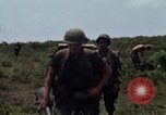 Image of Soldiers walking through the fields during Operation Delaware A Shau Valley Vietnam, 1968, second 33 stock footage video 65675026864