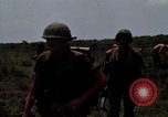 Image of Soldiers walking through the fields during Operation Delaware A Shau Valley Vietnam, 1968, second 34 stock footage video 65675026864