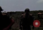 Image of Soldiers walking through the fields during Operation Delaware A Shau Valley Vietnam, 1968, second 35 stock footage video 65675026864
