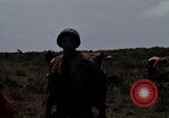 Image of Soldiers walking through the fields during Operation Delaware A Shau Valley Vietnam, 1968, second 36 stock footage video 65675026864