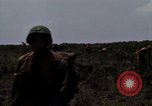 Image of Soldiers walking through the fields during Operation Delaware A Shau Valley Vietnam, 1968, second 37 stock footage video 65675026864
