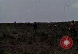 Image of Soldiers walking through the fields during Operation Delaware A Shau Valley Vietnam, 1968, second 39 stock footage video 65675026864