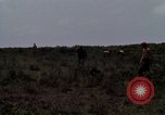 Image of Soldiers walking through the fields during Operation Delaware A Shau Valley Vietnam, 1968, second 40 stock footage video 65675026864