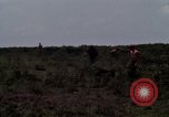 Image of Soldiers walking through the fields during Operation Delaware A Shau Valley Vietnam, 1968, second 41 stock footage video 65675026864