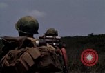 Image of Soldiers walking through the fields during Operation Delaware A Shau Valley Vietnam, 1968, second 42 stock footage video 65675026864