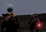 Image of Soldiers walking through the fields during Operation Delaware A Shau Valley Vietnam, 1968, second 44 stock footage video 65675026864