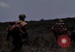 Image of Soldiers walking through the fields during Operation Delaware A Shau Valley Vietnam, 1968, second 46 stock footage video 65675026864