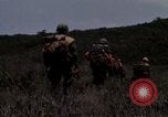 Image of Soldiers walking through the fields during Operation Delaware A Shau Valley Vietnam, 1968, second 48 stock footage video 65675026864
