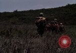 Image of Soldiers walking through the fields during Operation Delaware A Shau Valley Vietnam, 1968, second 51 stock footage video 65675026864
