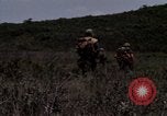 Image of Soldiers walking through the fields during Operation Delaware A Shau Valley Vietnam, 1968, second 52 stock footage video 65675026864