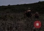 Image of Soldiers walking through the fields during Operation Delaware A Shau Valley Vietnam, 1968, second 54 stock footage video 65675026864
