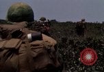 Image of Soldiers walking through the fields during Operation Delaware A Shau Valley Vietnam, 1968, second 59 stock footage video 65675026864