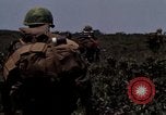 Image of Soldiers walking through the fields during Operation Delaware A Shau Valley Vietnam, 1968, second 60 stock footage video 65675026864