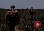 Image of Soldiers walking through the fields during Operation Delaware A Shau Valley Vietnam, 1968, second 62 stock footage video 65675026864
