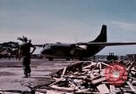 Image of UH-1Ds' and UH-1Bs' helicopters landing US troops during Operation Att Dau Tieng Vietnam, 1966, second 3 stock footage video 65675026866
