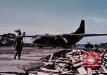Image of UH-1Ds' and UH-1Bs' helicopters landing US troops during Operation Att Dau Tieng Vietnam, 1966, second 5 stock footage video 65675026866