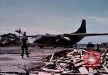 Image of UH-1Ds' and UH-1Bs' helicopters landing US troops during Operation Att Dau Tieng Vietnam, 1966, second 6 stock footage video 65675026866