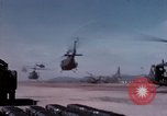 Image of UH-1Ds' and UH-1Bs' helicopters landing US troops during Operation Att Dau Tieng Vietnam, 1966, second 11 stock footage video 65675026866
