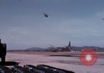 Image of UH-1Ds' and UH-1Bs' helicopters landing US troops during Operation Att Dau Tieng Vietnam, 1966, second 37 stock footage video 65675026866