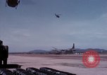 Image of UH-1Ds' and UH-1Bs' helicopters landing US troops during Operation Att Dau Tieng Vietnam, 1966, second 38 stock footage video 65675026866