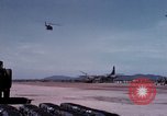 Image of UH-1Ds' and UH-1Bs' helicopters landing US troops during Operation Att Dau Tieng Vietnam, 1966, second 44 stock footage video 65675026866