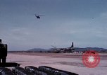 Image of UH-1Ds' and UH-1Bs' helicopters landing US troops during Operation Att Dau Tieng Vietnam, 1966, second 46 stock footage video 65675026866