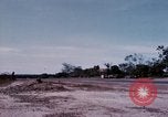 Image of UH-1Ds' and UH-1Bs' helicopters landing US troops during Operation Att Dau Tieng Vietnam, 1966, second 47 stock footage video 65675026866